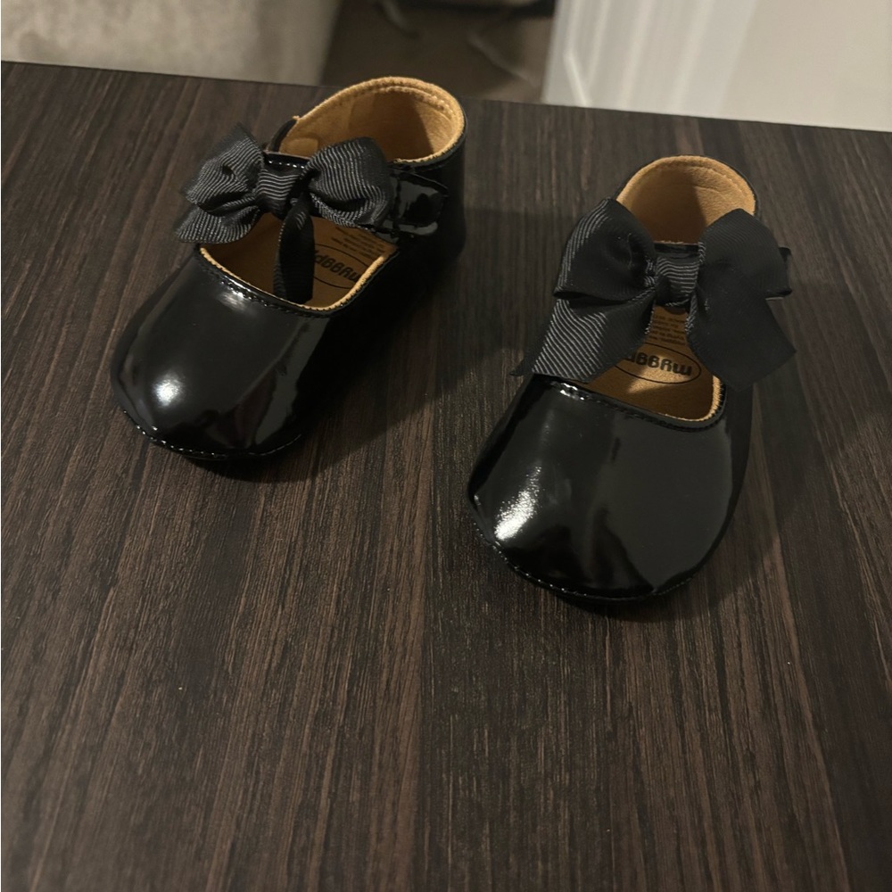 Black dress shoes with bow